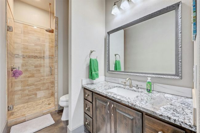 One of three full bathrooms, all are roomy with ample storage. | Image 24