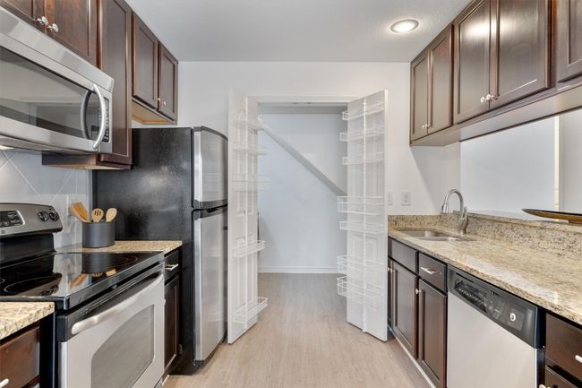 The generous pantry offers room for storing all your ingredients and kitchen essentials. | Image 15