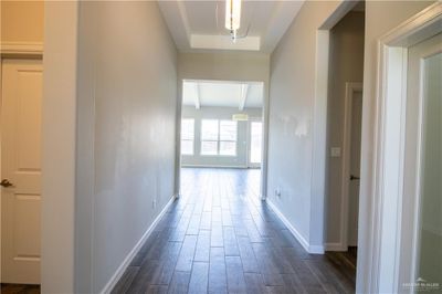 Hallway featuring dark wood-type flooring | Image 3