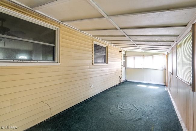 View of unfurnished sunroom | Image 35