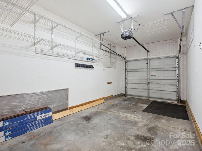 Single car garage has built in storage | Image 25