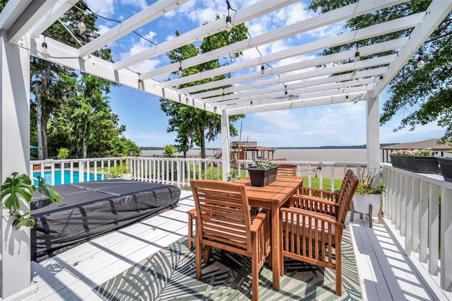Stunning lakeside views with the option to dine under this charming pergola. Enjoy the beauty of nature while relaxing in this picturesque setting | Image 19