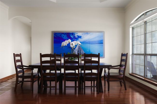 Dining area featuring wood finished floors, baseboards, and crown molding | Image 15