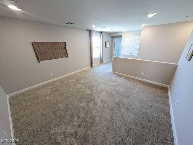 Empty room with light colored carpet and baseboards | Image 18