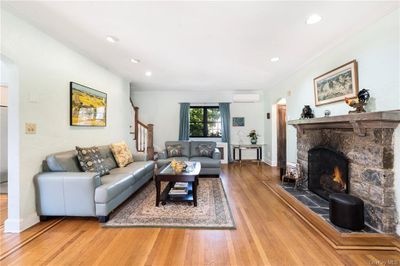 Spacious Living Room Graced With Rich Hardwood Flooring | Image 3