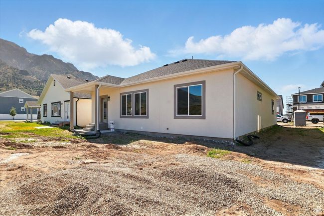 Back of property with a mountain view | Image 37
