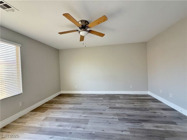 Spare room with visible vents, baseboards, a ceiling fan, and wood finished floors | Image 27
