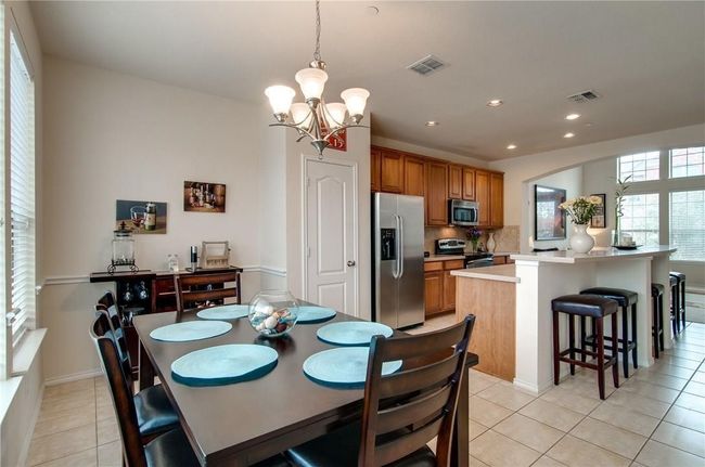 Tiled dining area featuring a chandelier | Image 15