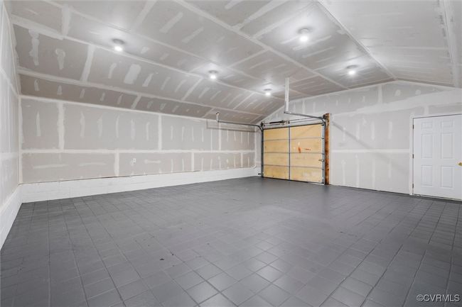 Garage featuring baseboards | Image 40