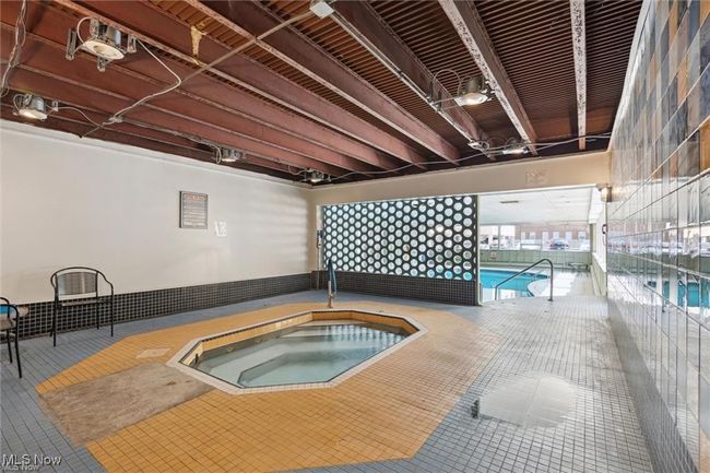 Pool with an indoor hot tub | Image 6