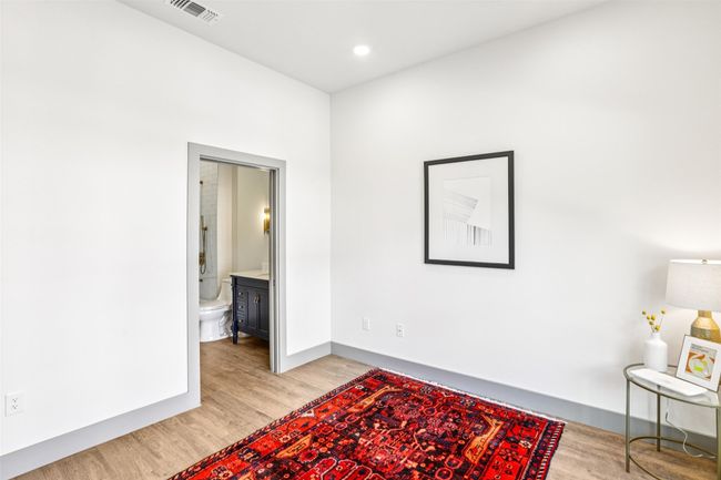 Sitting room featuring light wood-type flooring and recessed lighting | Image 23