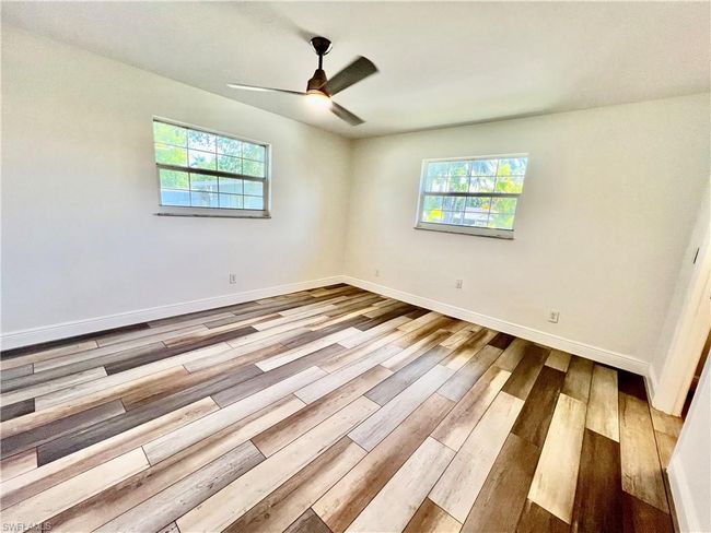 Primary bedroom with walk in closet and ensuite private bath. | Image 21