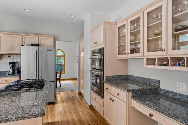 A built-in desk area offers a convenient nook for staying organized or working from home. | Image 8