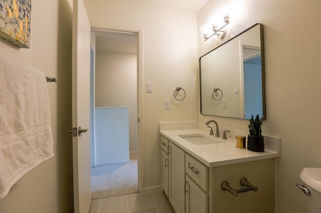 Bathroom with custom vanity and tile patterned flooring. | Image 29