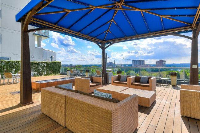 Wooden deck with an outdoor living space and a view of city | Image 19