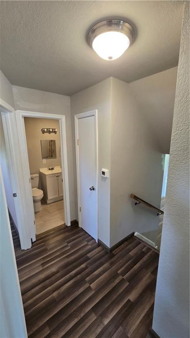 Upper level hallway view to LR floor-Bath2 | Image 17