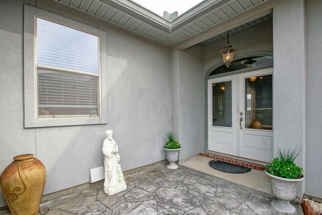 Front door entrance with partial glass doors and transom. | Image 6