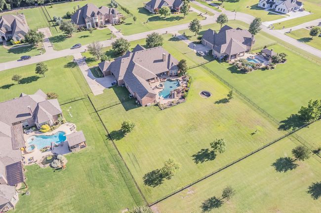 Aerial perspective of suburban area with a pool area | Image 38