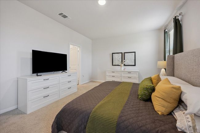 Bedroom with light colored carpet and baseboards | Image 26