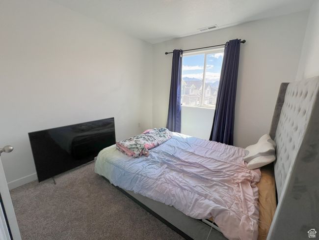 Bedroom with carpet floors | Image 5