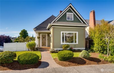 Welcome to this beautiful North Slope home where historic charm meets modern living. It was elegantly modernized in 2012, including updating the plumbing and electrical. Recent improvements include a newer furnace and heat pump, exterior paint, water heater, roof, and sewer line. | Image 1