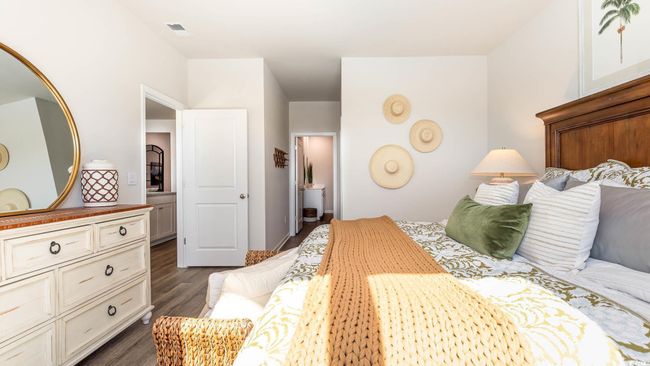 Bedroom with visible vents and dark wood-type flooring | Image 17