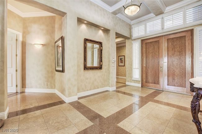 Entrance foyer with ornamental molding, beamed ceiling, and baseboards | Image 24