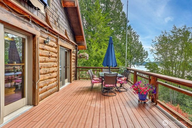 Huge wrap-around trex deck perfect for entertaining and relaxing with a water view! | Image 24