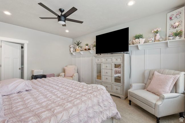 Bedroom featuring light colored carpet, recessed lighting, and a ceiling fan | Image 19