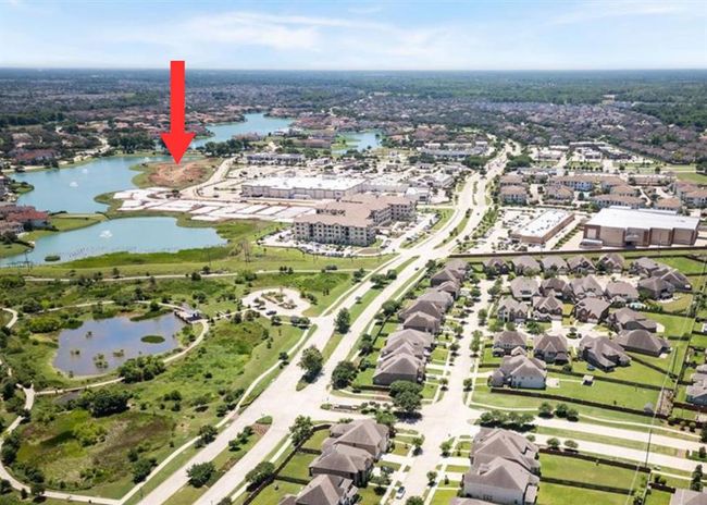 An aerial perspective highlighting the prime location of this lot in Monet Estates, just moments away from Kroger, dining, and shopping options. Enjoy the convenience of having everyday necessities and leisure destinations right at your doorstep, all while living in the tranquil, gated Riverstone community. | Image 5