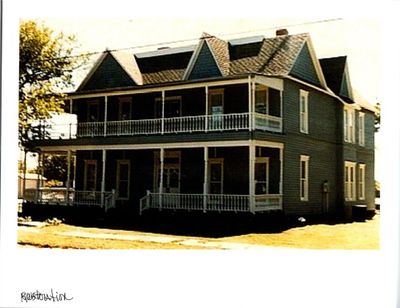 Rear view of house featuring covered porch and a balcony | Image 2