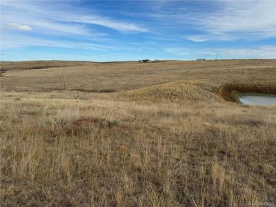 Rolling hills with small pond | Image 3