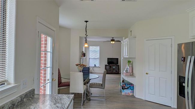 Breakfast area followed by family living area | Image 10