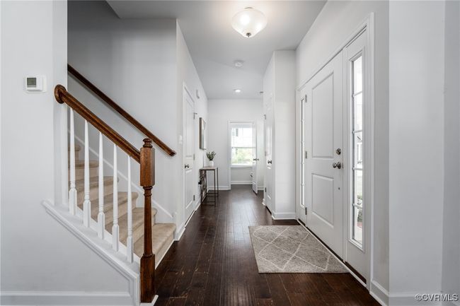 Foyer Leading to Powder Room and Door to Garage | Image 4