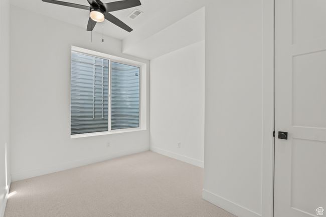 Unfurnished bedroom featuring carpet flooring and ceiling fan | Image 57