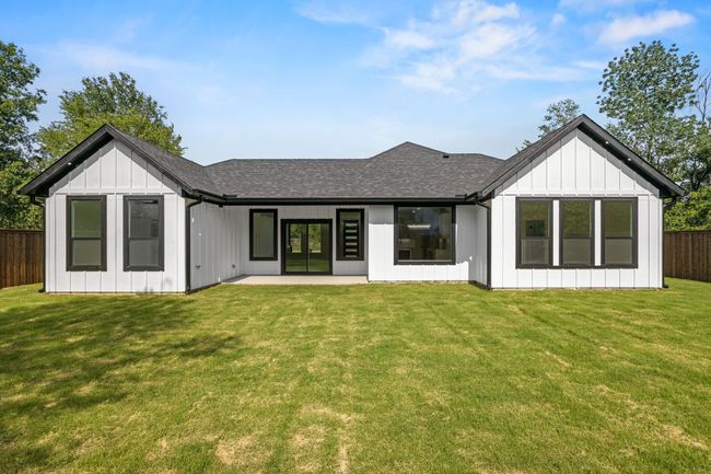 Back of property with a shingled roof and a patio | Image 32