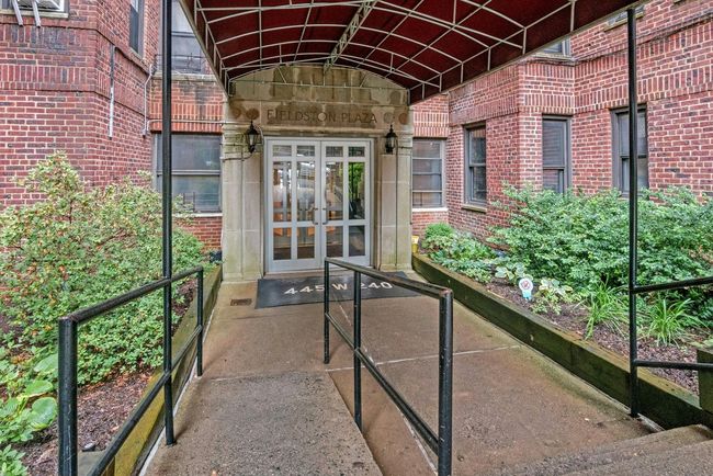 Doorway to property with french doors and brick siding | Image 19