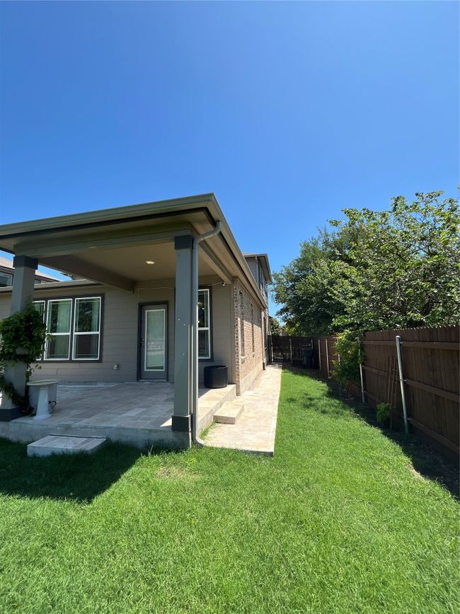 Back of house featuring a patio, a fenced backyard, and a lawn | Image 26