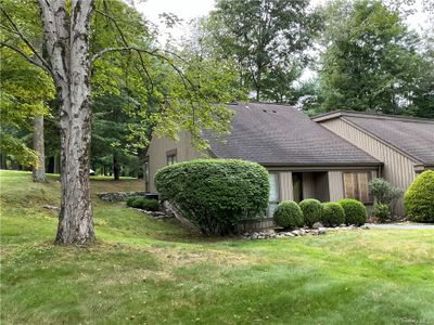 View of side of home with a yard | Image 2