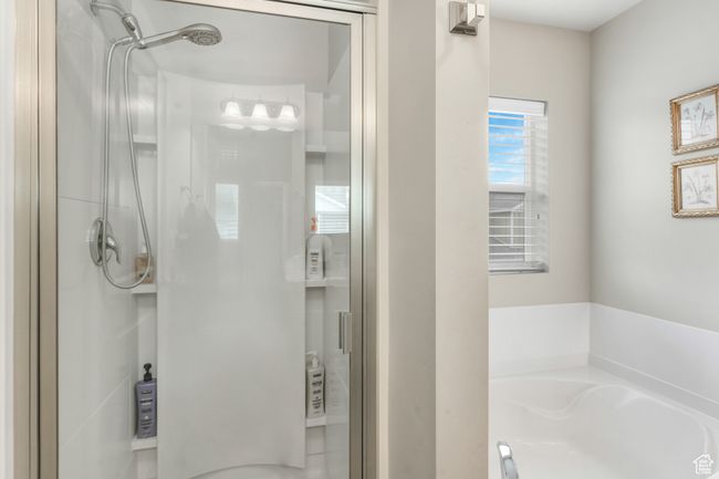 Full bathroom with a bath and a shower stall | Image 17