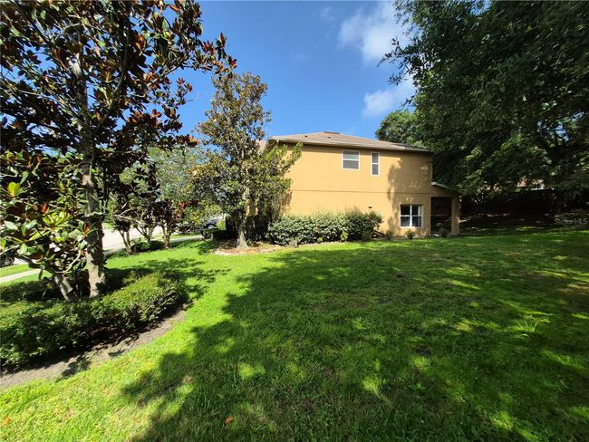 Side yard with magnolia trees | Image 10