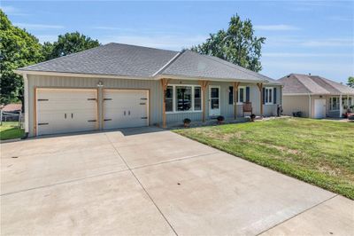 Single story home with a garage and a front yard | Image 3