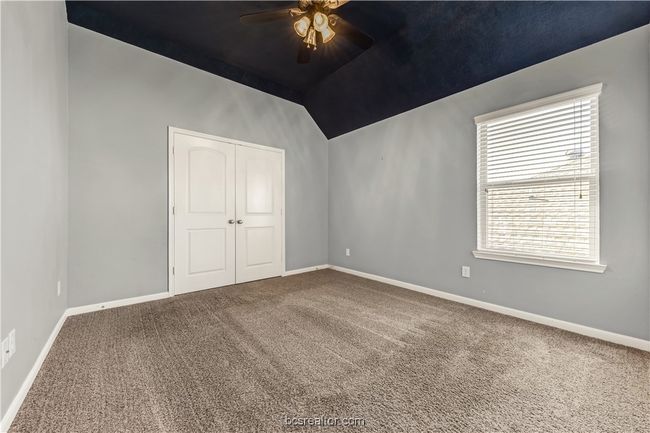 Unfurnished room with ceiling fan, carpet flooring, and vaulted ceiling | Image 21