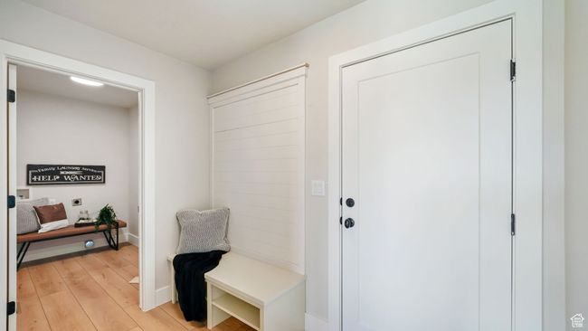 Mudroom featuring light wood-type flooring and baseboards | Image 12