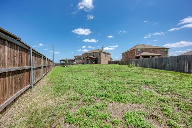 View of fenced backyard | Image 33