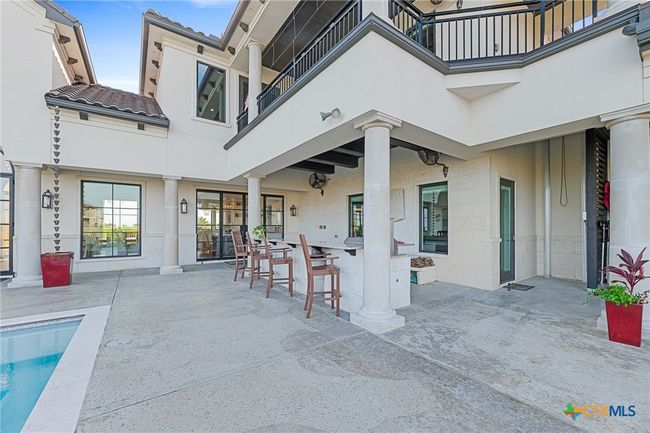 Loggia with Outdoor Kitchen with Custom Smoker/Grill and Speed Cooker, Drink Refrigerator, Sink, and TV | Image 27