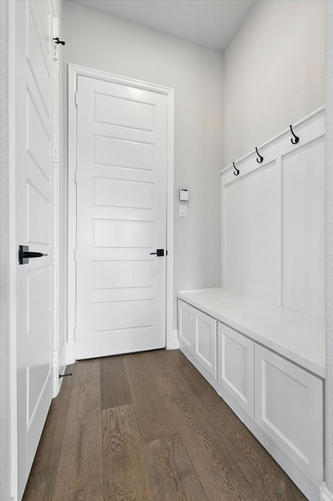 Mudroom with dark wood-type flooring | Image 19