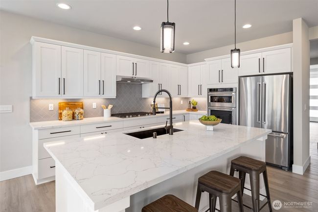 Photos are of a home in a different community and are for illustration purposes only to reflect typical finishes. May depict seller enhancements. Colors and options may vary. | Image 8