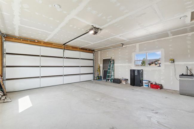 Garage with a garage door opener | Image 9
