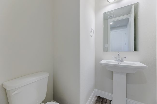 Half bath with toilet and baseboards | Image 13
